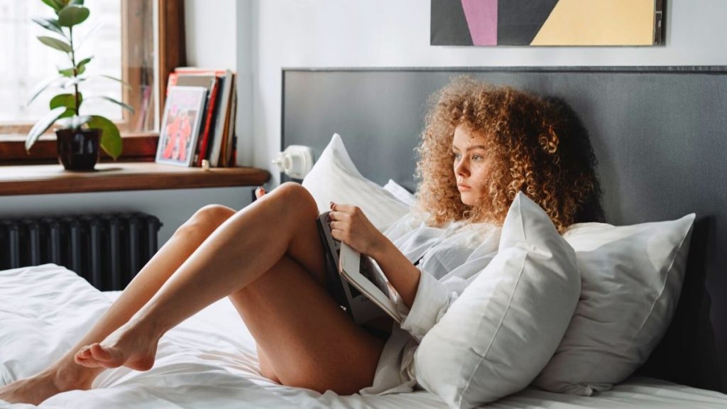 woman laying on bed